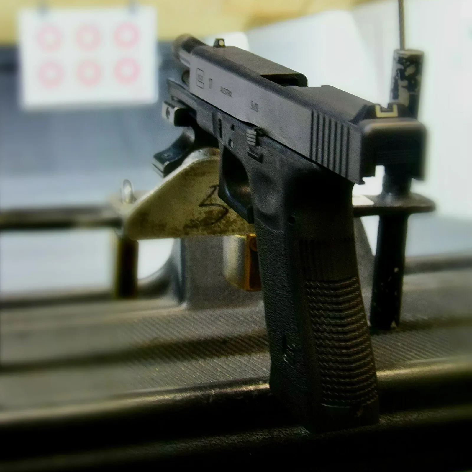 Generation 3 Glock 17 9mm semi-automatic pistol photographed from above against a neutral background