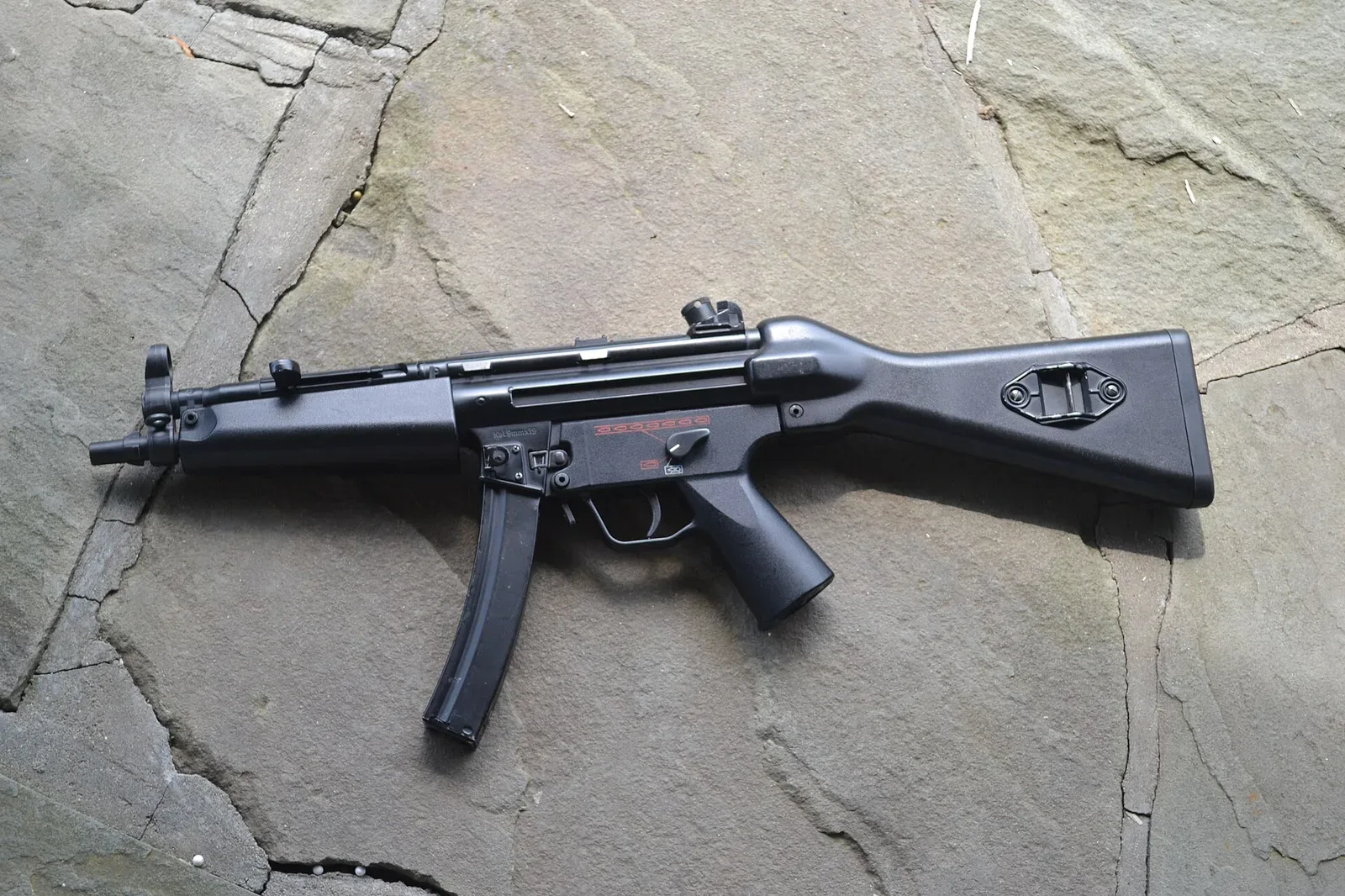 Tokyo Marui MP5A4 airsoft AEG (automatic electric gun) replica showing the distinctive features of modern airsoft weapons design.