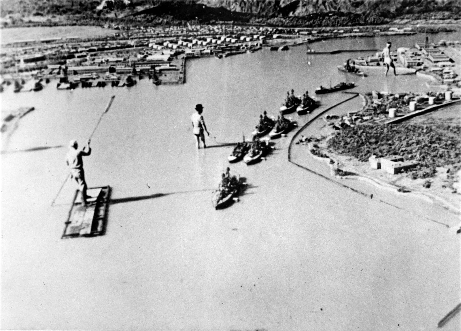 Miniature mock-up model of U.S. Naval Base Pearl Harbor showing buildings, ships, and harbor layout used for military simulation planning