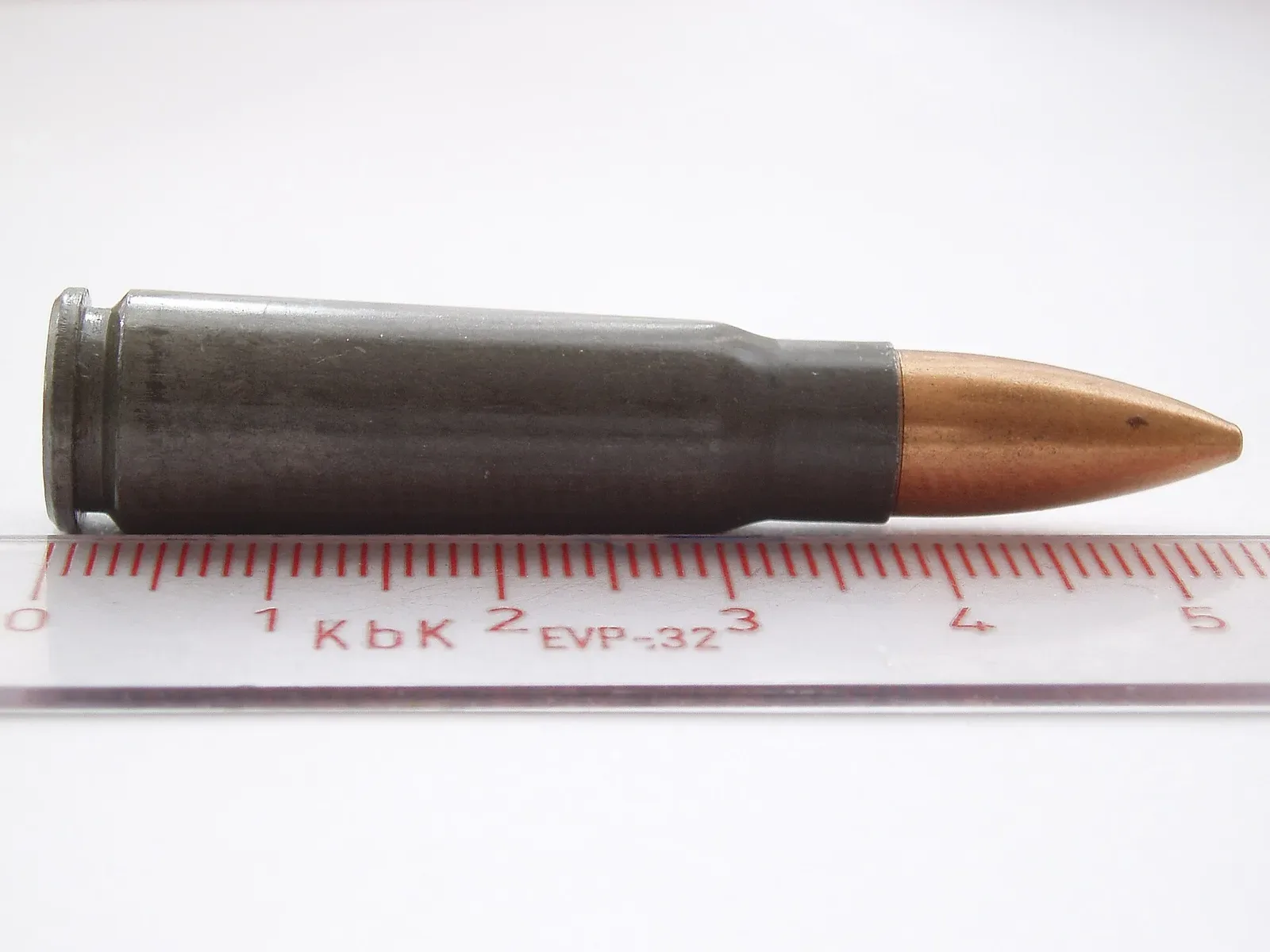 A single 7.62×39mm full metal jacket rifle cartridge displayed against a neutral background, showing the complete round with brass casing, primer, and bullet.