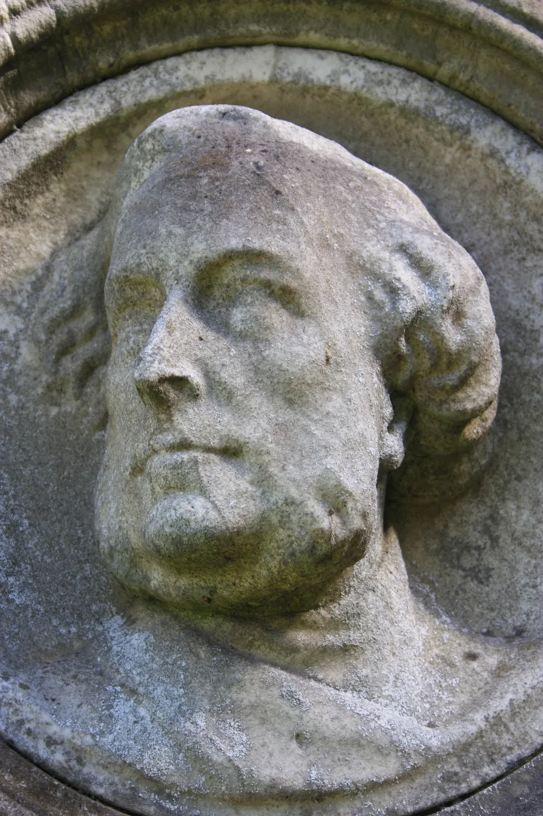 Portrait of Reverend Robert Lee depicted on his grave monument, showing a 19th-century Church of Scotland minister in clerical attire.