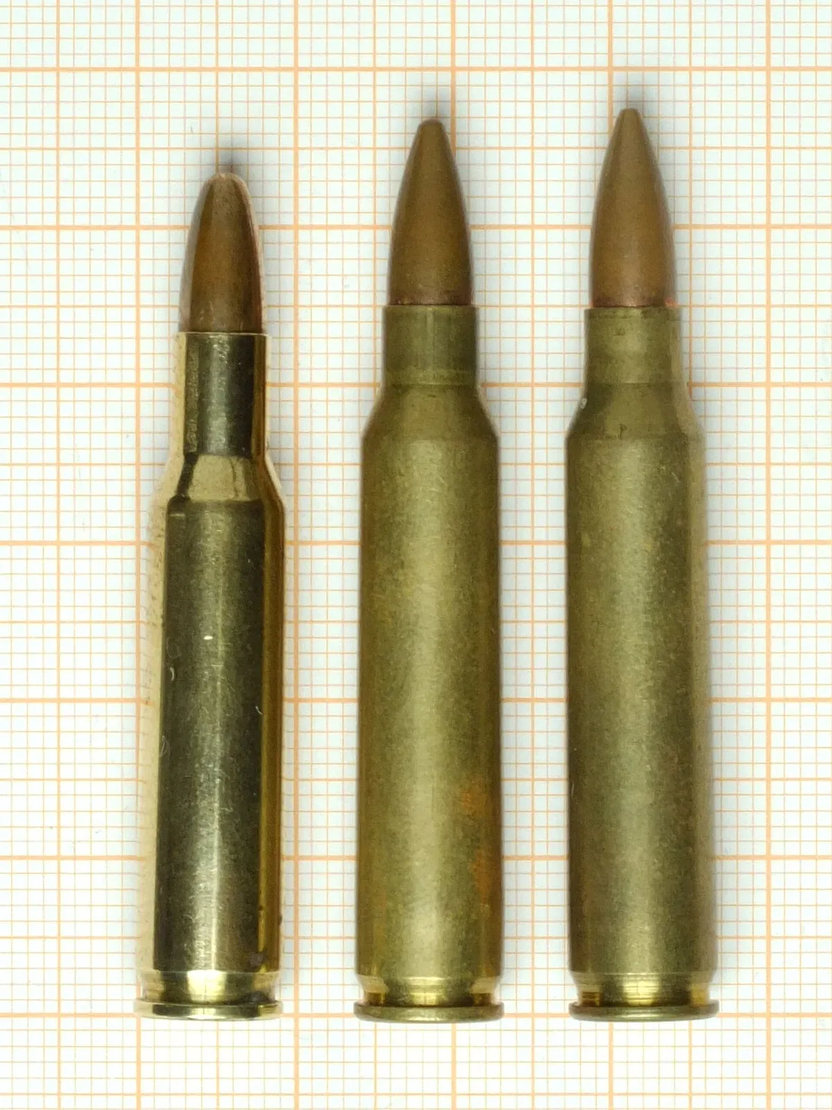 Three cartridges displayed side by side: .222 Remington, .223 Remington, and 5.56×45mm NATO, showing relative size and visual comparison