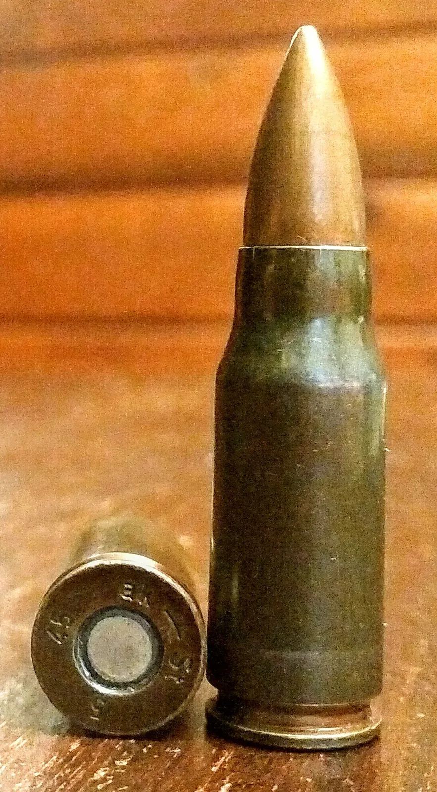 Technical diagram showing the 7.92x33 Kurz intermediate cartridge alongside comparison rounds, displaying the distinctive shorter case design
