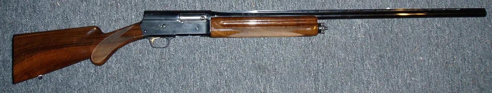 Side view of a Browning Auto-5 shotgun chambered in 20 gauge magnum, displayed against a plain background.