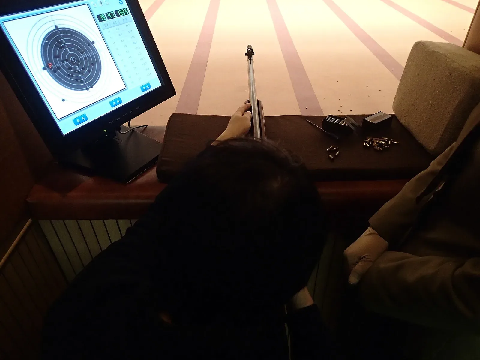 Wide view of an outdoor shooting range facility with multiple target stations and shooting positions