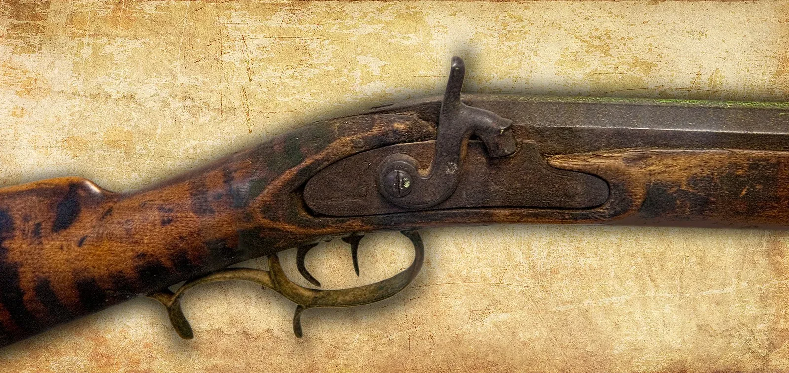 Historical Civil War era rifle photographed from above, showing the full length of the wooden stock, metal barrel, and firing mechanism in detail