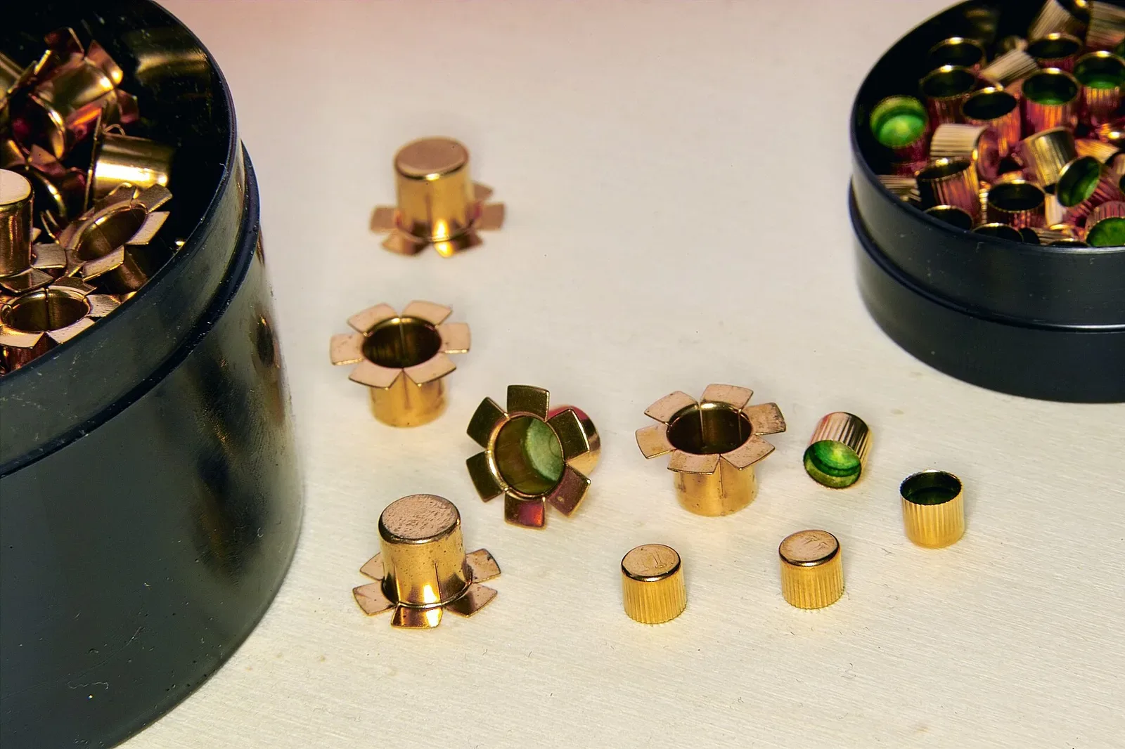 Two percussion caps of different sizes, 4.5mm and 6.0mm diameter, shown against a neutral background