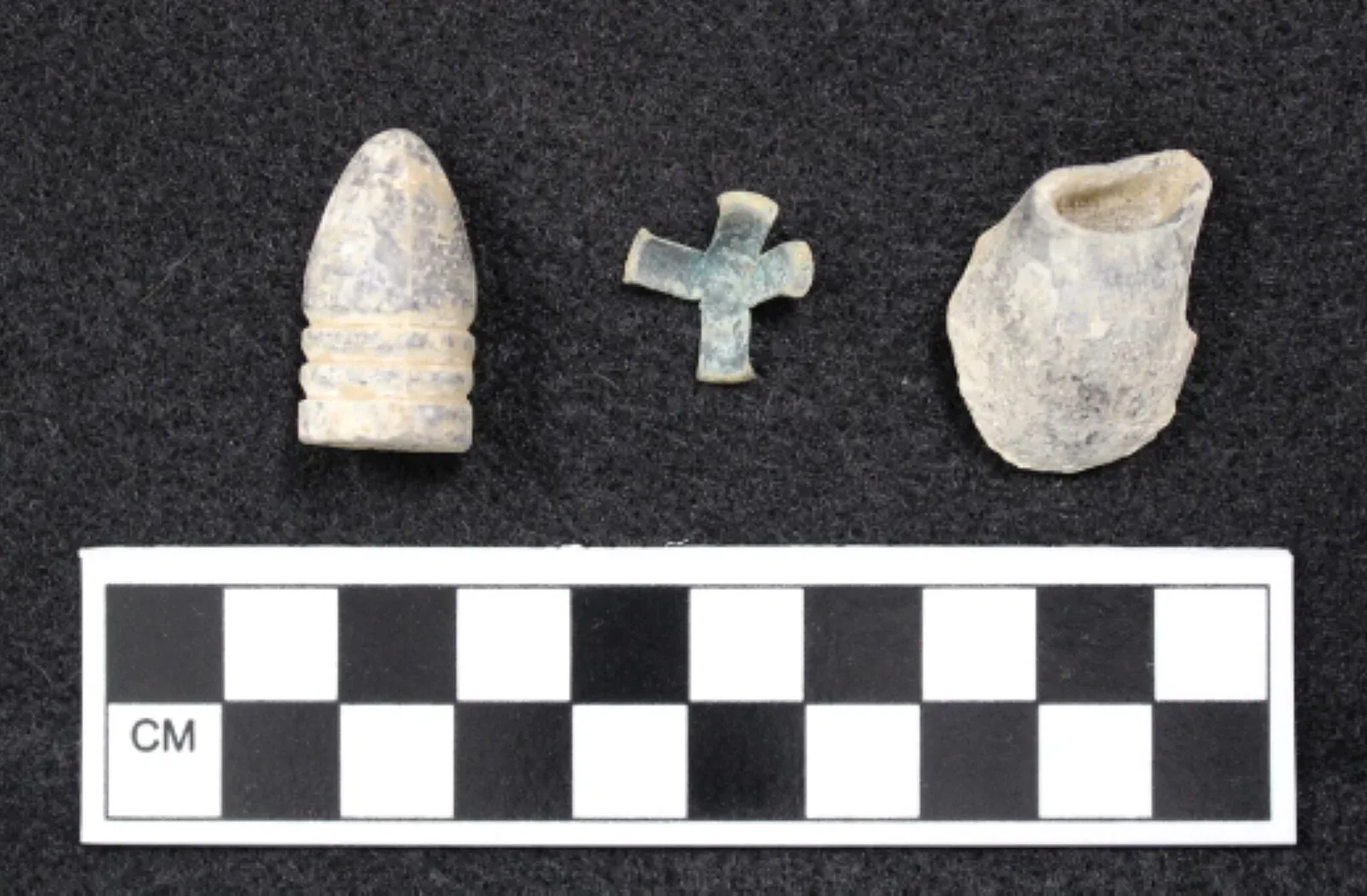 Cross-section diagram or photograph of a Minié ball ammunition round, displaying the hollow conical base and lead construction that defined the ammunition type.