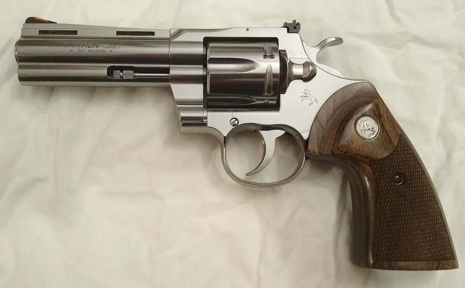 Colt Python revolver, 2020 production model, 4-inch barrel, stainless steel, .357 Magnum caliber, shown from the right side