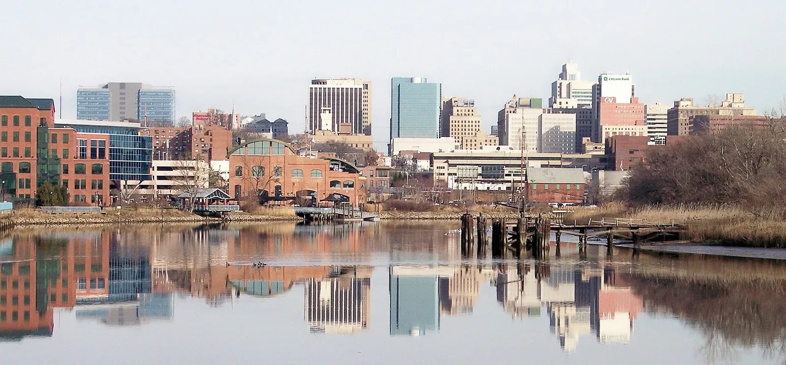 Skyline of downtown Wilmington, Delaware with the Christina River visible in the foreground, photographed in December