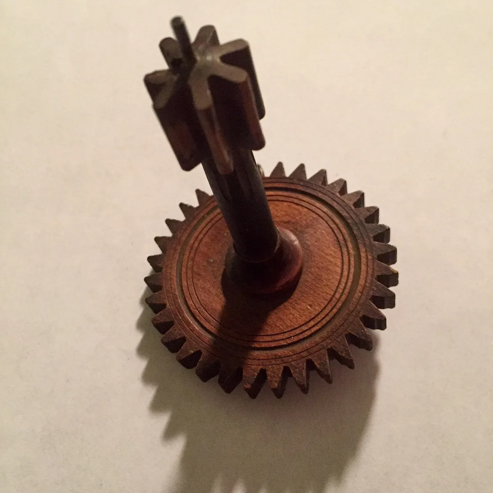 Wooden gear with milled teeth manufactured by Eli Terry, demonstrating mechanical standardization and precision manufacturing techniques
