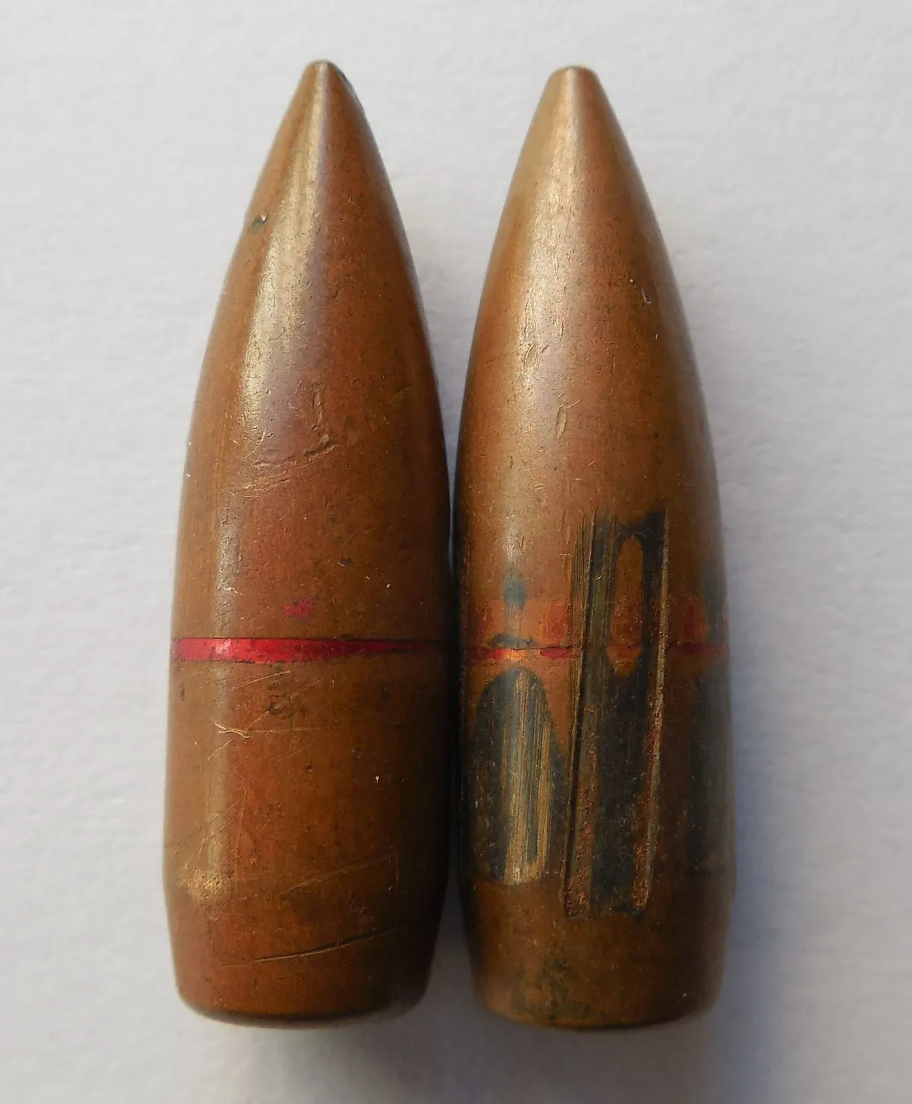 57-N-231 standard 7.62×39mm military bullets, showing unfired and fired examples side by side to demonstrate rifling marks on the projectile surface