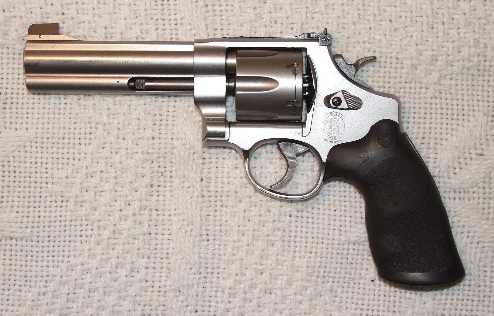 Smith & Wesson 625 revolver chambered in .45 ACP, displayed against a plain background showing the full profile from the left side