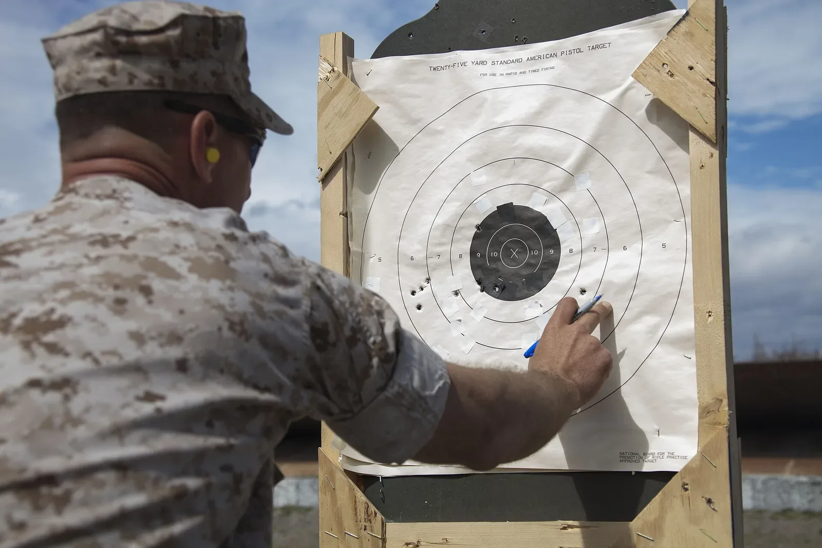 Official rifle competition target showing concentric scoring rings with numerical values and central X-ring bullseye used for high power rifle competition scoring