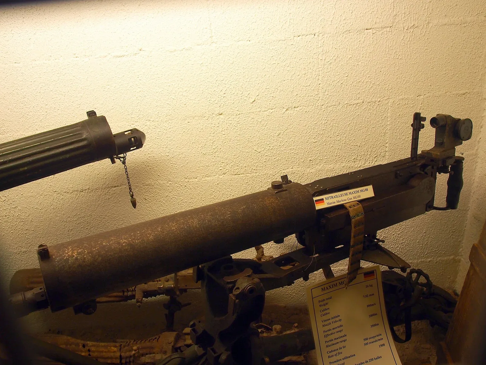 A German MG08 Maxim machine gun on display at the Musée Somme 1916, showing the weapon's distinctive configuration and mounting system used during World War I.