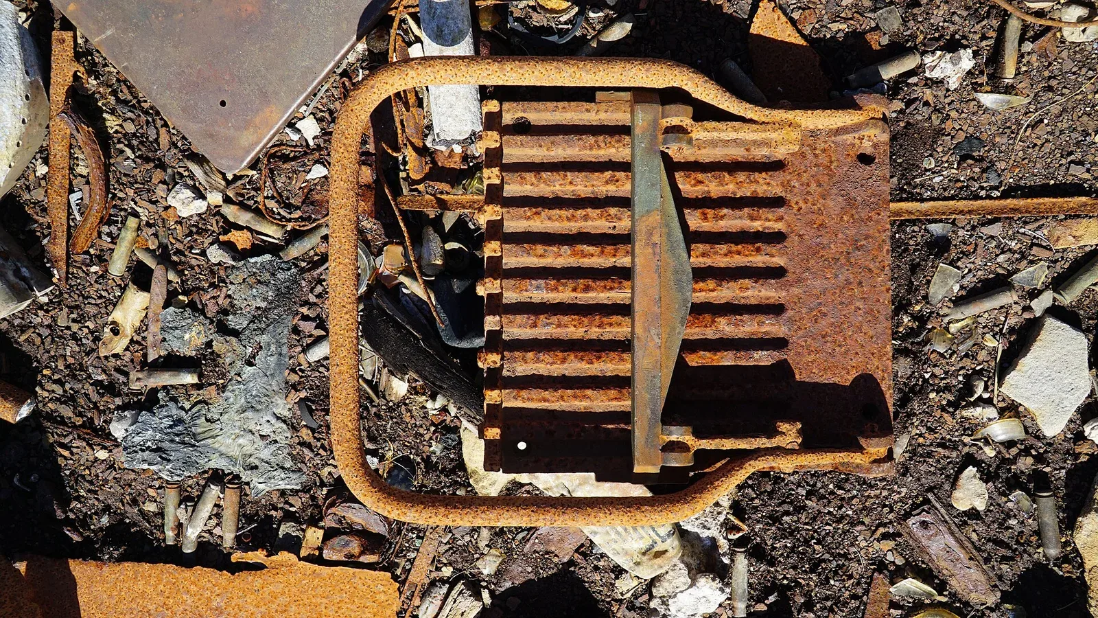 A .50 caliber machine gun ammunition belt loader device, showing the mechanical system designed to load rounds into linked ammunition belts