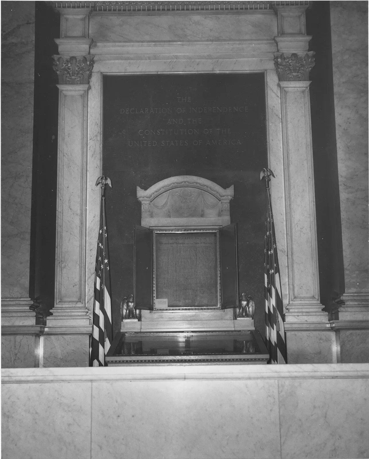 The Declaration of Independence and Constitution displayed in glass cases at the Library of Congress, prior to transfer to the National Archives.