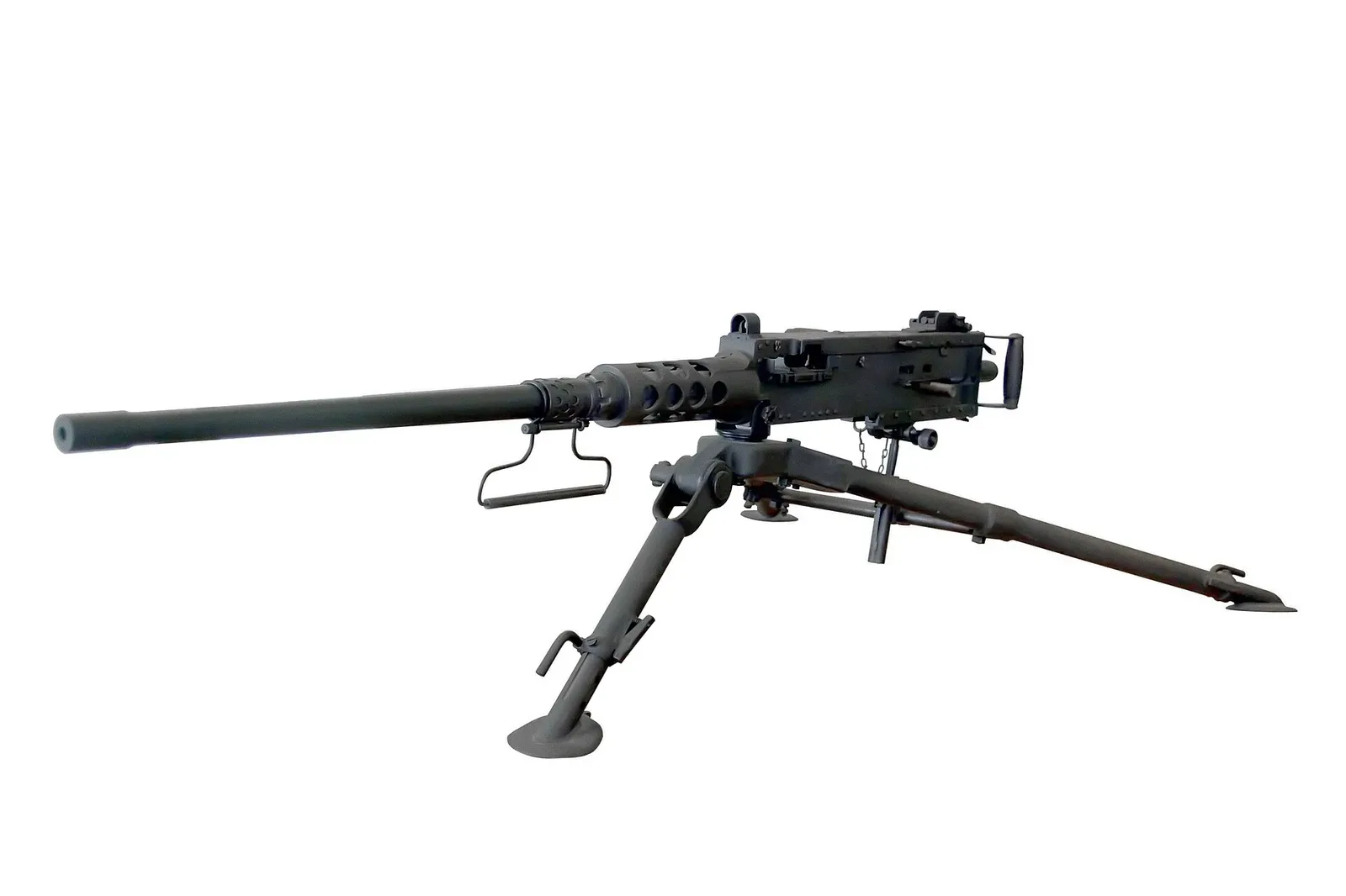 M2 Browning machine gun displayed in a museum setting, showing the complete weapon system with its distinctive receiver, barrel, and mounting hardware.