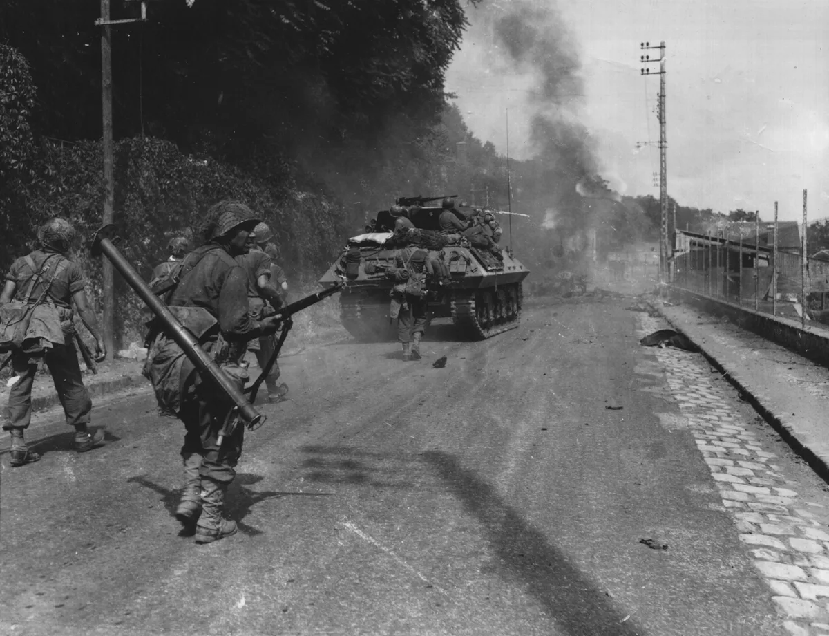 American soldiers advancing near Fontainebleau, France, August 1944