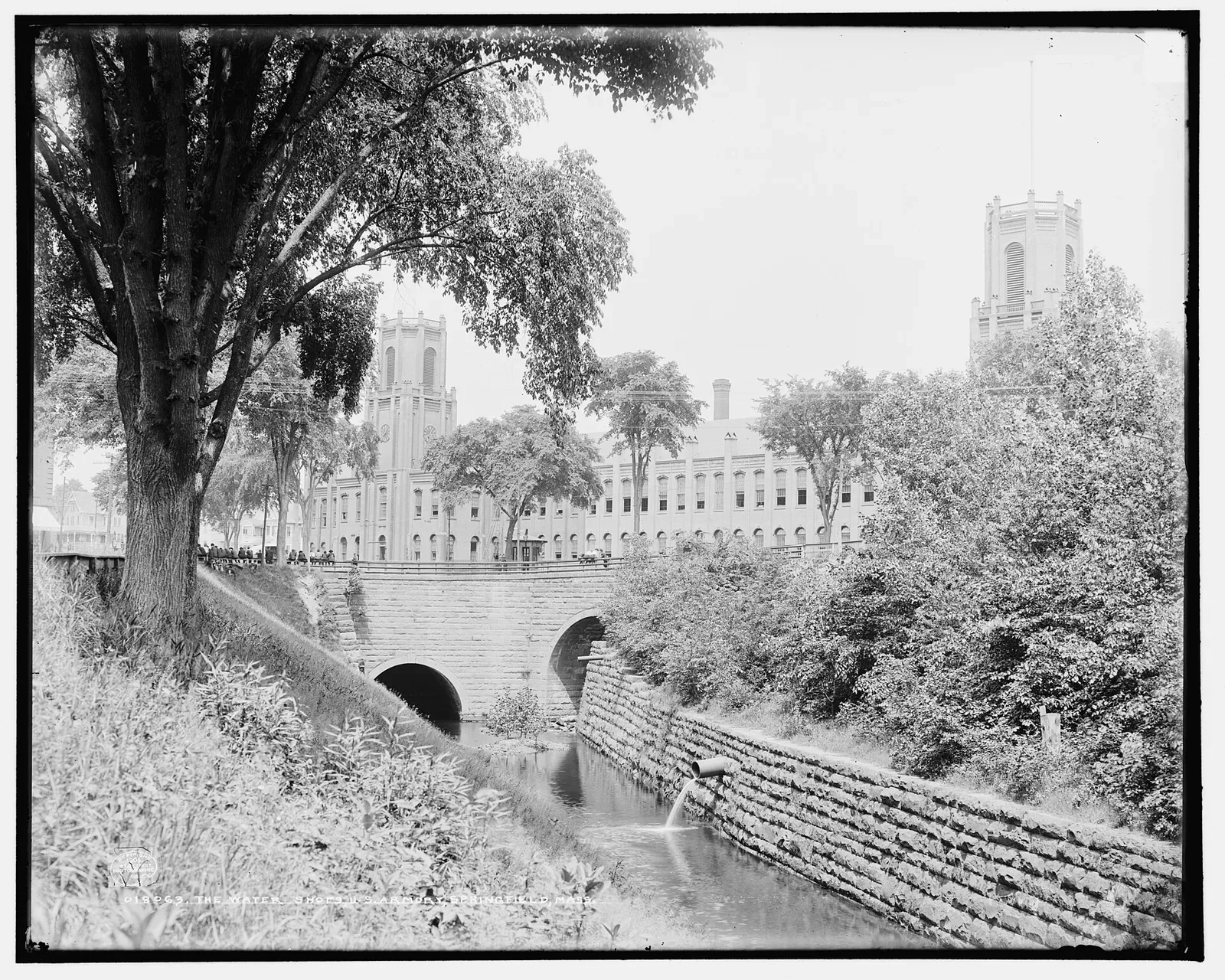 The watershops building at Springfield Armory in Springfield, Massachusetts, photographed around 1905, showing a large industrial brick structure with multiple windows and attached buildings.