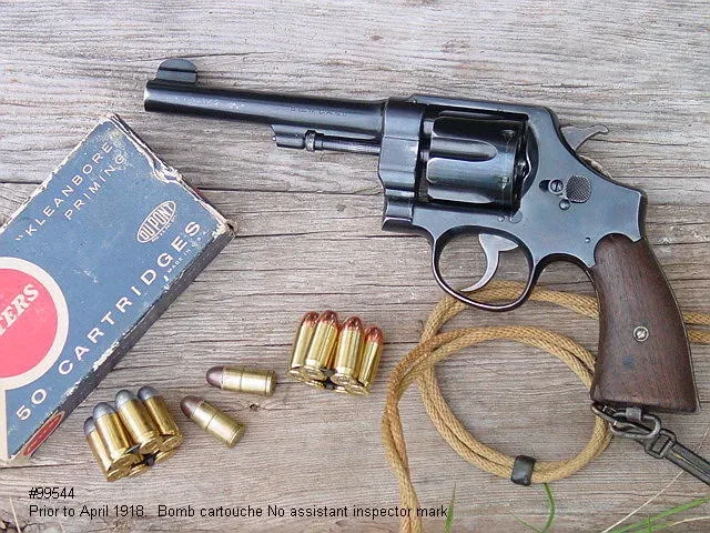 Smith & Wesson M1917 revolver in .45 ACP with moon clips and auto-rim cartridges displayed alongside ammunition