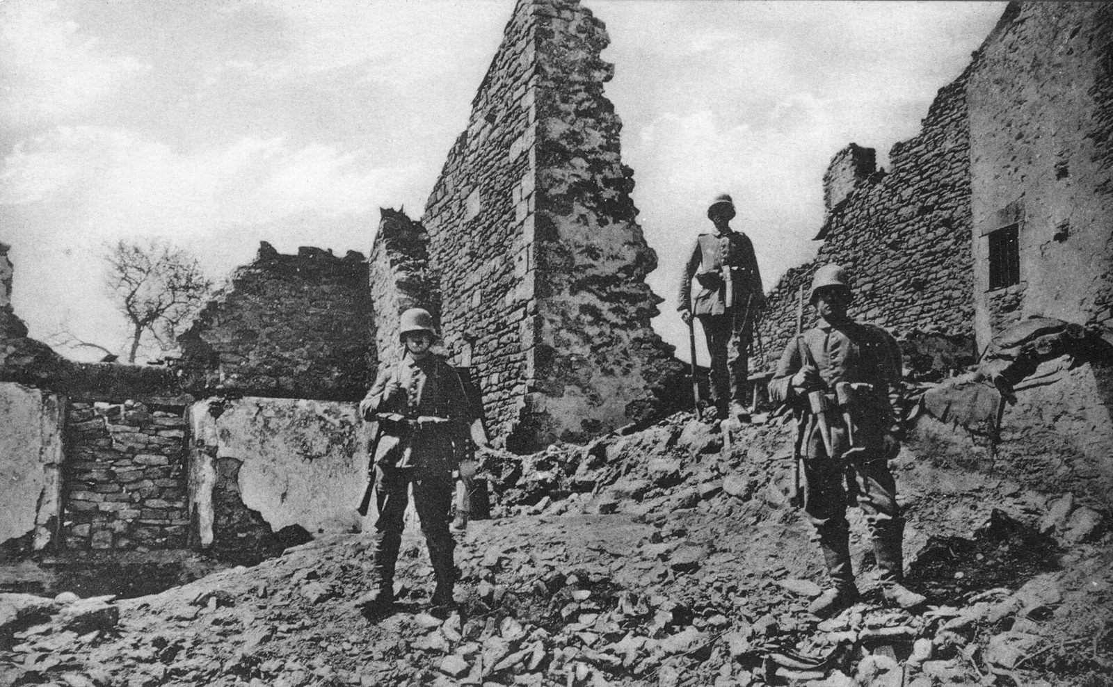 German Sturmtruppen soldiers in full combat gear and helmets moving through a trench or fortified position during World War I