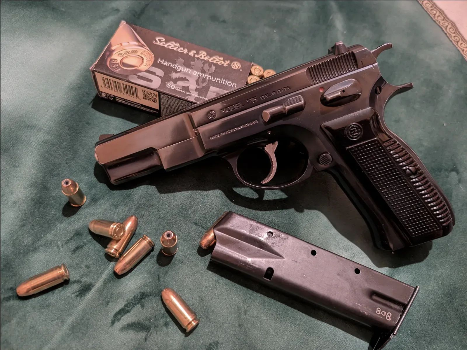 CZ 75 pistol, first production version, shown in profile detail view against light background