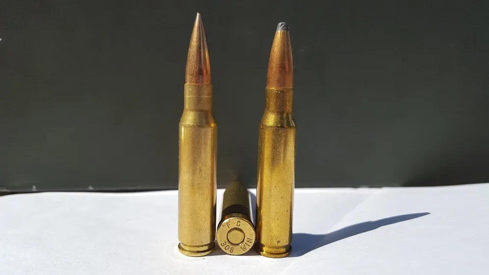 Three .308 Winchester cartridges showing different bullet types and construction variations