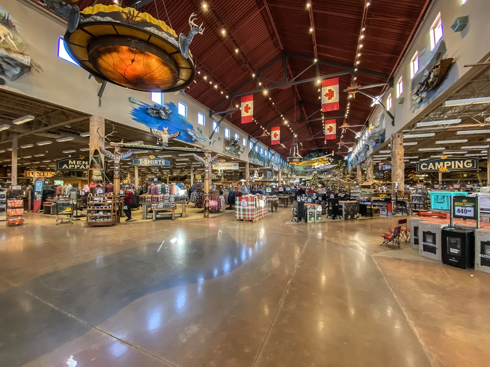 Interior view of a Bass Pro Shops retail location showing product displays and merchandise areas
