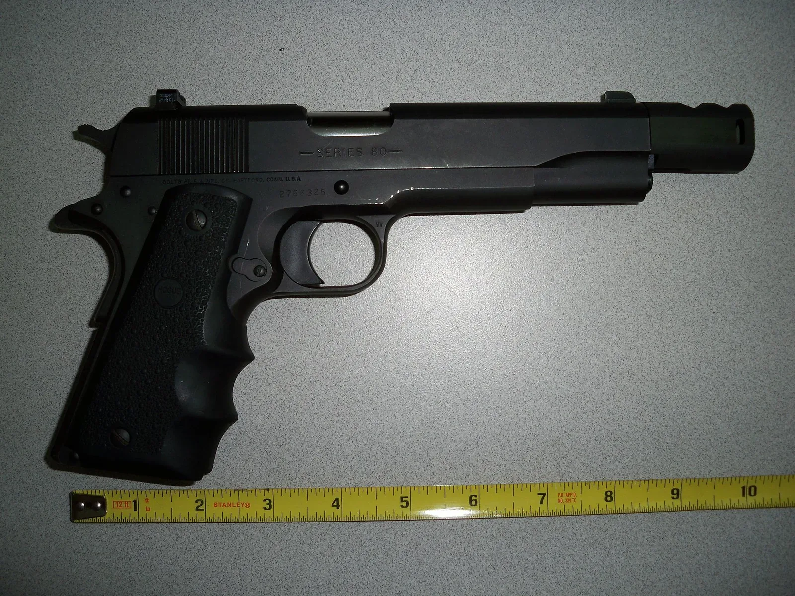 A modern M1911 pistol in .460 Rowland caliber photographed from above against a neutral background, showing the full profile of the single-action semi-automatic handgun.