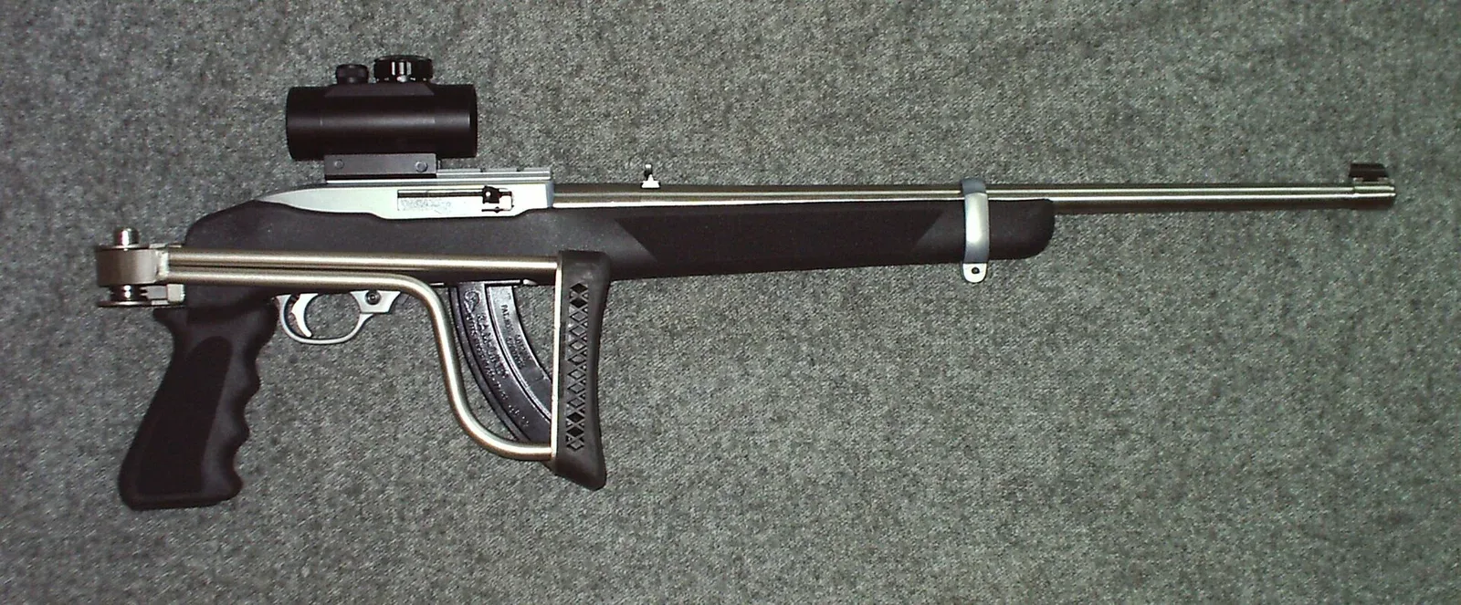Ruger 10/22 rifle with stainless steel finish and Butler Creek folding stock