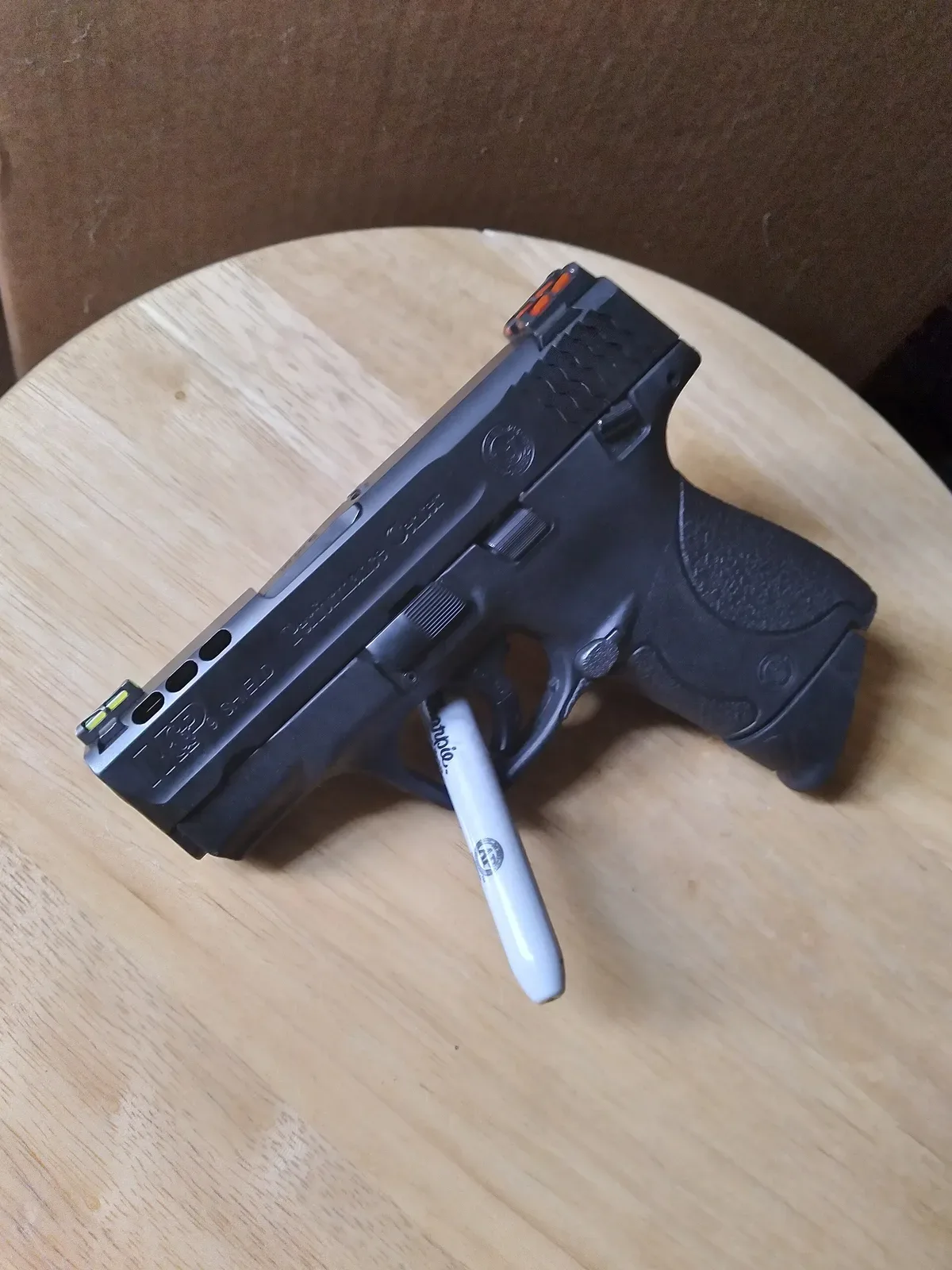 Smith & Wesson M&P9 Shield Performance Center pistol, photographed against a plain background showing the complete firearm from the side