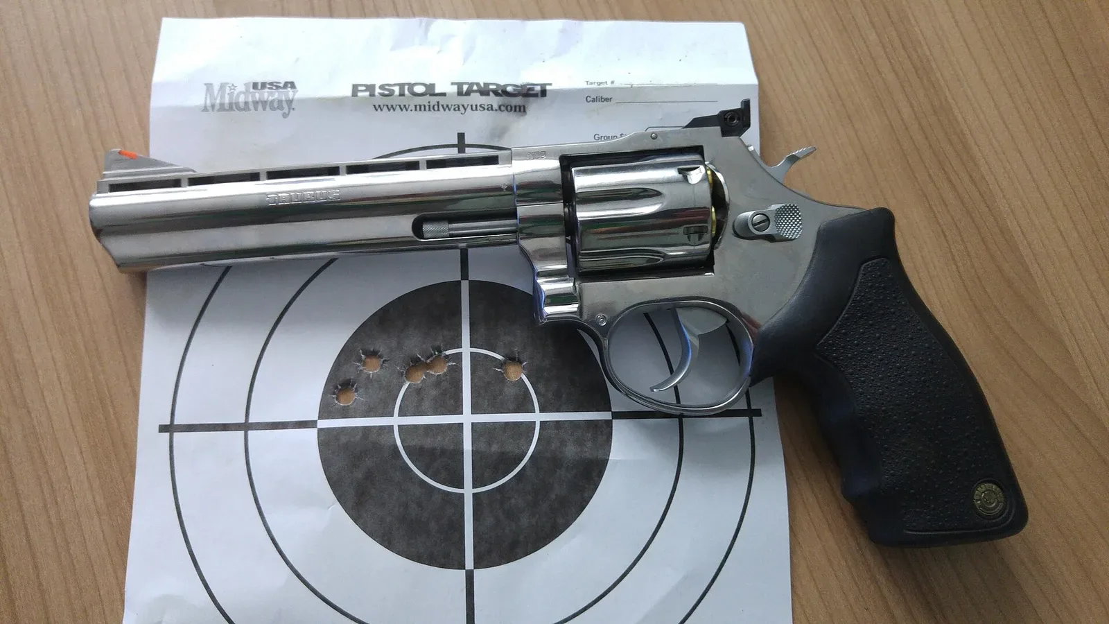 Taurus revolver Model 689, a stainless steel double-action revolver with dark grip panels