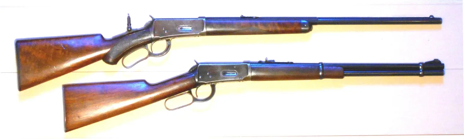 Winchester Model 1894 lever-action rifle shown in profile, displaying the distinctive receiver, lever, and wood furniture characteristic of the modern production model.