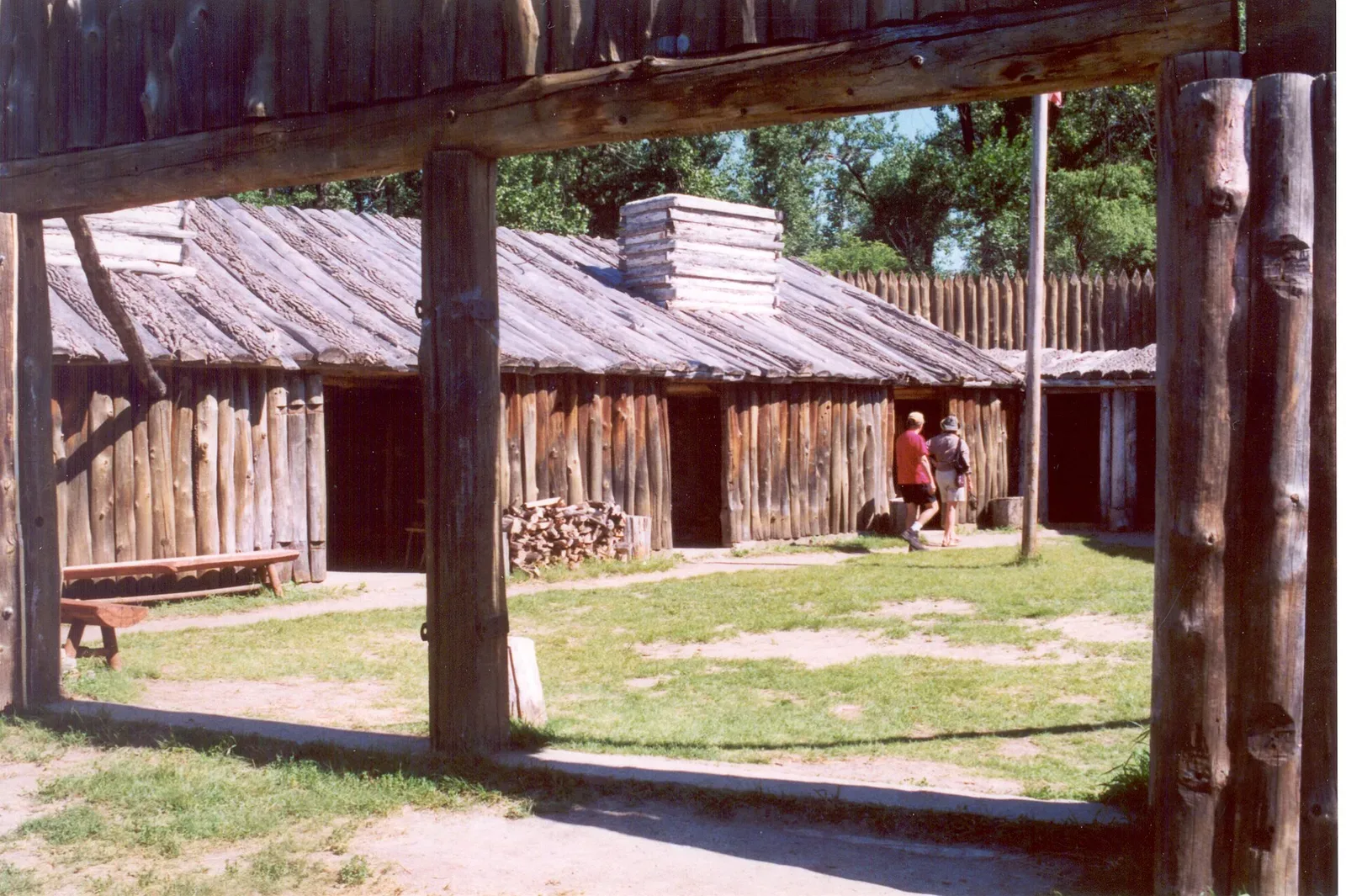 Interior reconstruction of Fort Mandan showing wooden log construction, fireplaces, and period furnishings from the Lewis and Clark Expedition winter camp in North Dakota