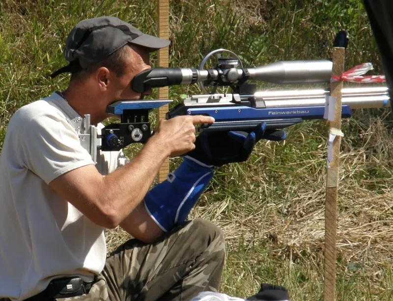 Field target competition setup showing steel knockdown targets positioned at various distances on an outdoor range with natural terrain and vegetation.