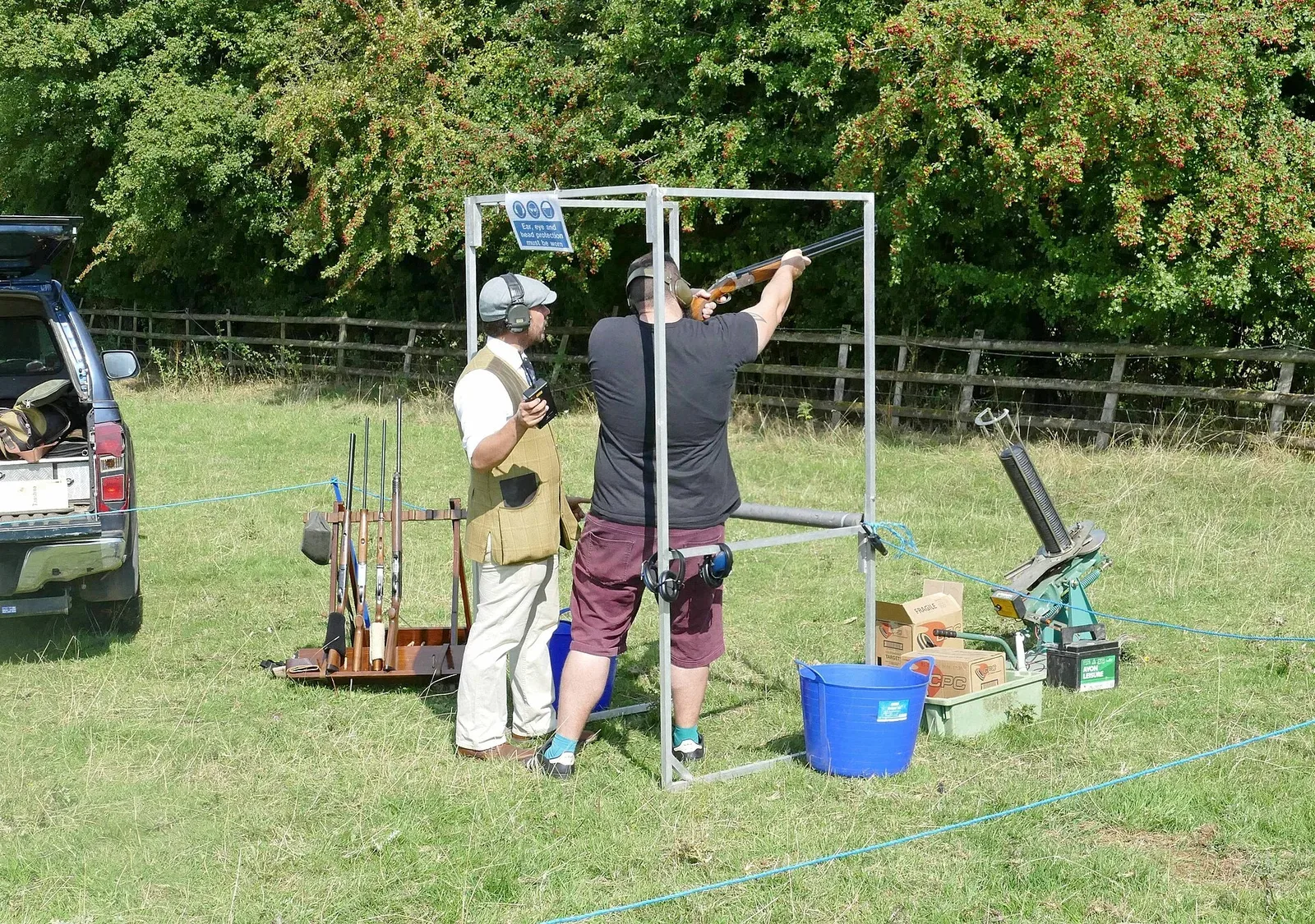 Clay pigeon shooting competition setup at the Hawkesbury Show, showing shooters engaging targets in an outdoor competition environment