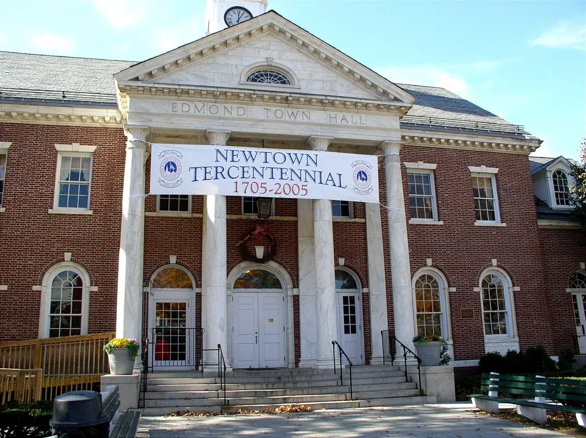 Edmond Town Hall in Newtown, Connecticut, a brick colonial-style public building with white trim and cupola