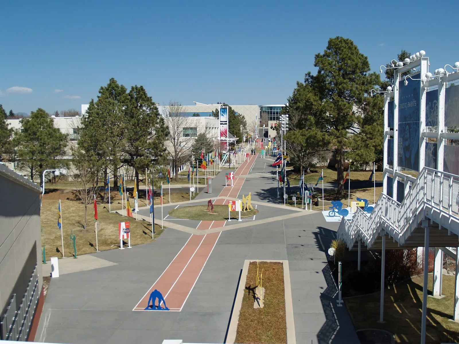 The United States Olympic Committee headquarters building in Colorado Springs, a modern multi-story structure with glass and stone facade.