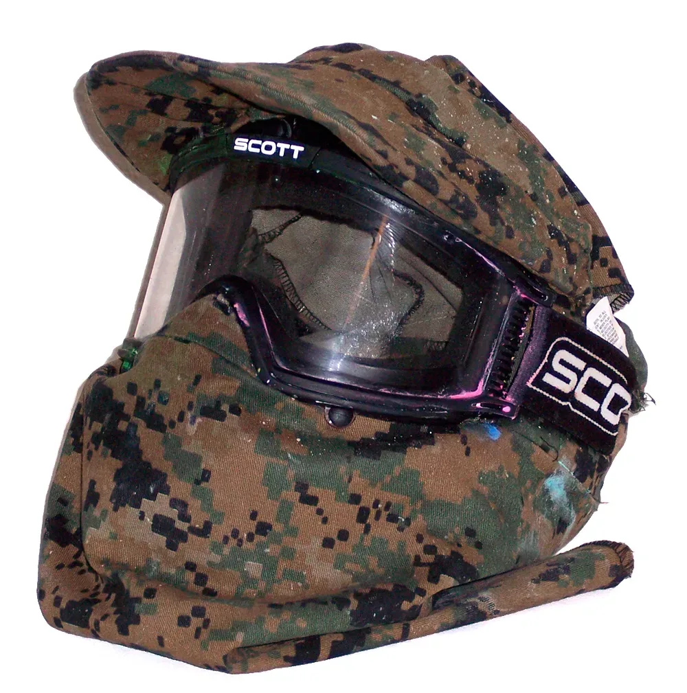Paintball protective mask with integrated MARPAT camouflage cover fitted over the lens and frame