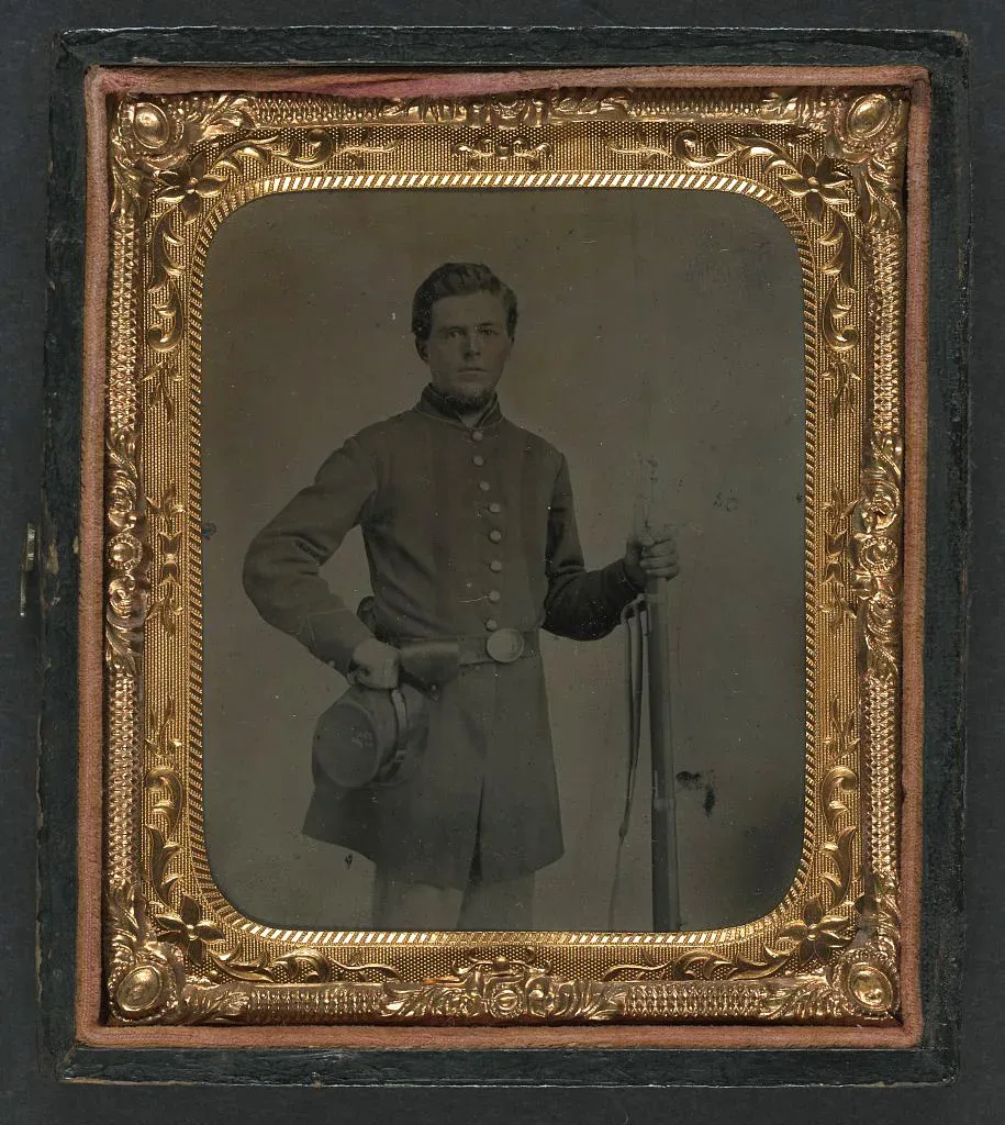Union soldier in Company A, 12th Michigan Volunteers Regiment wearing period uniform and holding a Lorenz musket, circa 1860s
