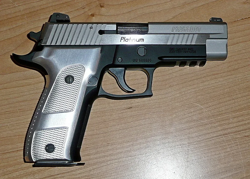 SIG Sauer Elite Platinum 9mm pistol shown in right-side profile view against a neutral background