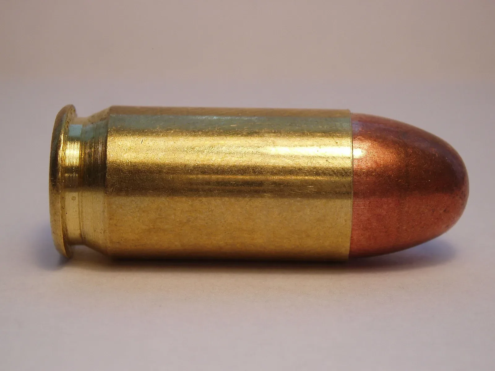 A .45 ACP full metal jacket cartridge manufactured by Sellier & Bellot, shown as a single round against a neutral background