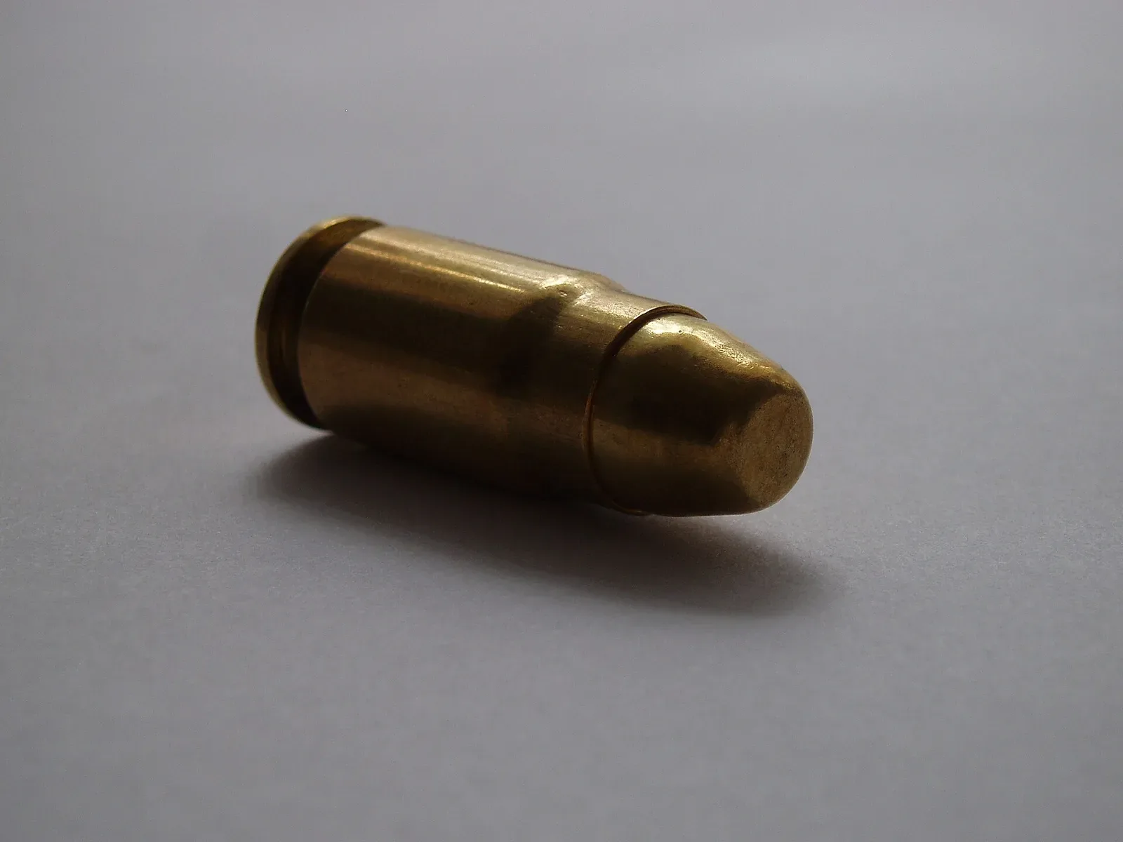 A single .357 SIG cartridge with full metal jacket bullet, manufactured by Sellier & Bellot.