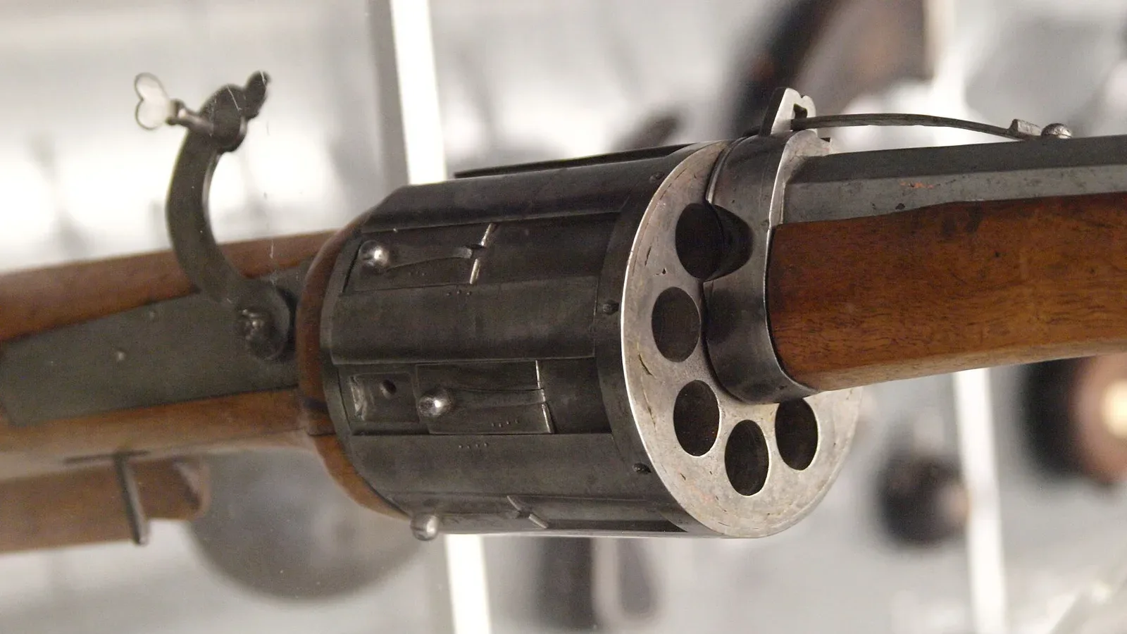 Close-up detail of a matchlock revolver (Drehling) mechanism made in Nuremberg, Germany circa 1580, showing the serpentine arm and internal firing mechanism components.