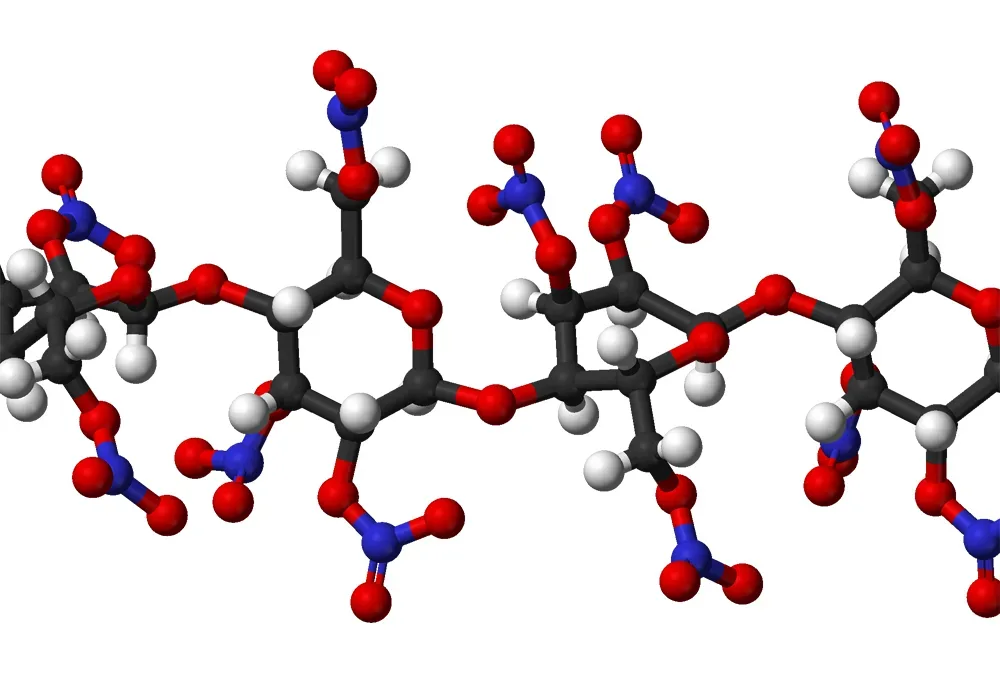 Three-dimensional molecular ball-and-stick model of nitrocellulose showing the spatial arrangement of carbon, hydrogen, nitrogen, and oxygen atoms