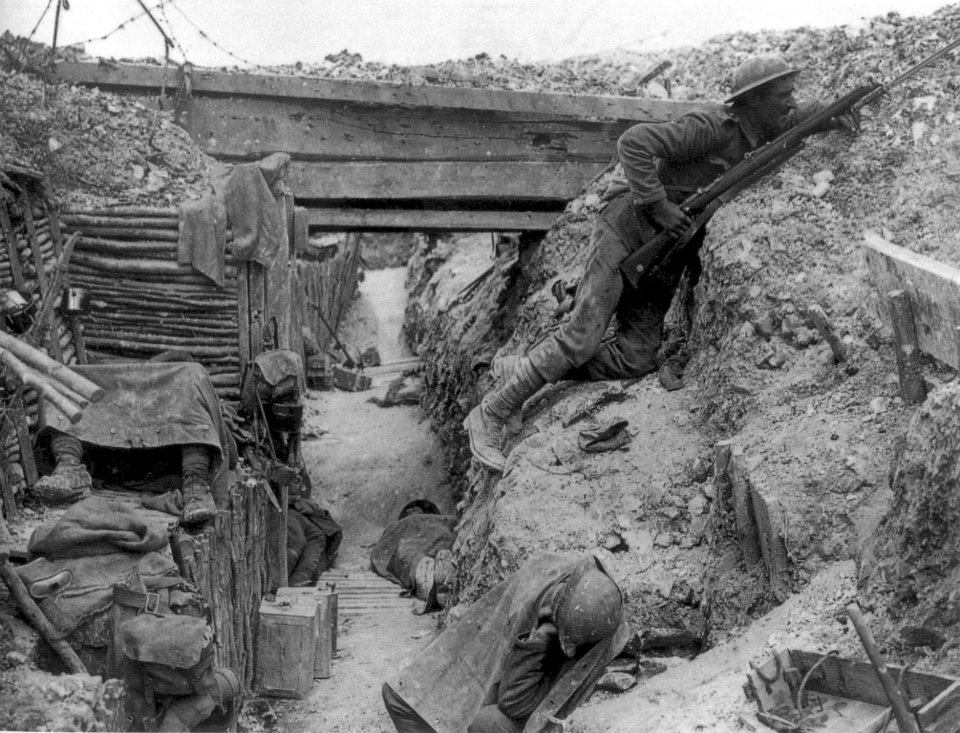 British soldiers of the Cheshire Regiment in a trench at the Somme in 1916, showing the muddy conditions and cramped quarters of trench warfare during World War I.