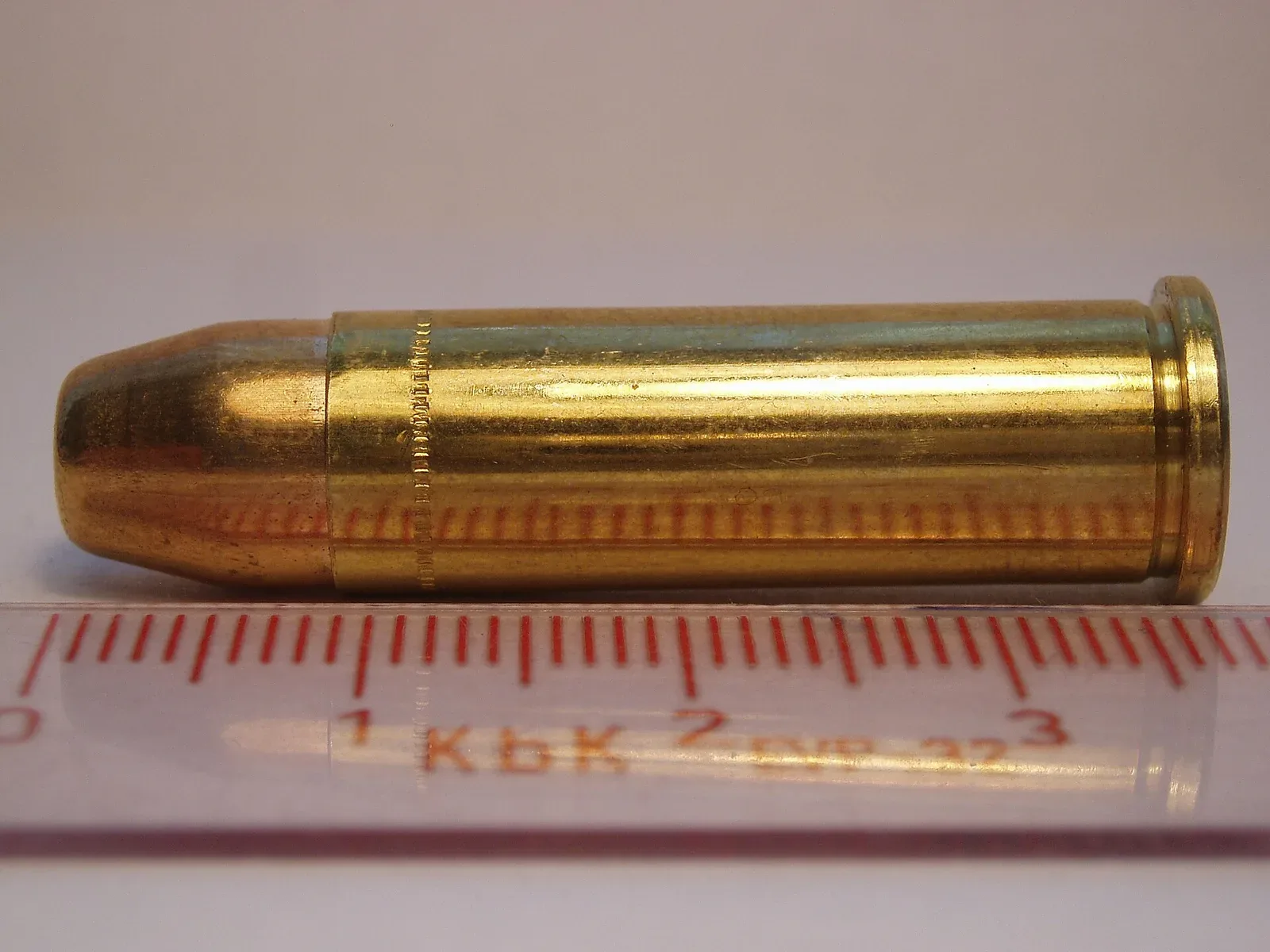 A .38 Special full metal jacket cartridge by Sellier & Bellot, showing the assembled round with visible bullet, case, and base components.