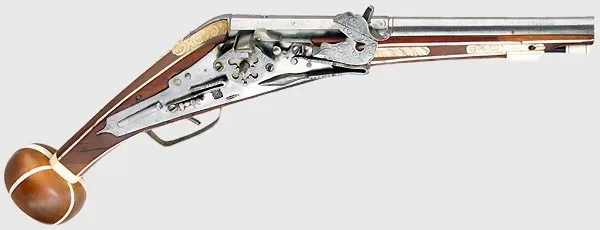 A wheellock pistol known as a 'Puffer,' manufactured in Augsburg around 1580, featuring an octagonal then round smooth bore barrel and ornate metalwork typical of the period.